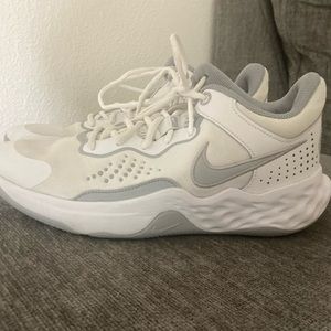 Women’s white Nike shoes.